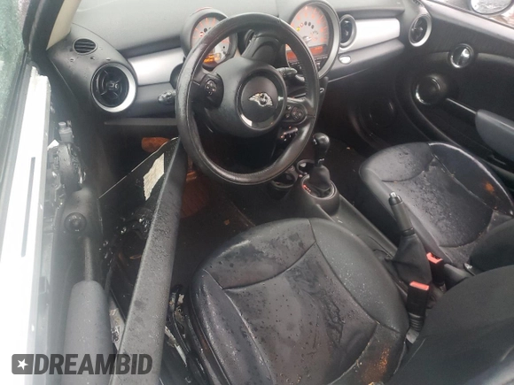 2011 MINI Hardtop with VIN WMWSU3C57BT096973, listed as a Copart auction lot 52726185 with 90,545 mi miles and Salvage title. Bid and sale history available at DreamBid. Image 8.