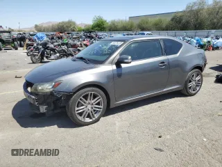 2011 Scion tC z VIN JTKJF5C78B3000928, wystawiony jako Copart lot #54076415 z przebiegiem 128 753 mil mil oraz Szkoda całkowita • Salvage title. Historia ofert i sprzedaży dostępna na DreamBid. Obrazek 1.