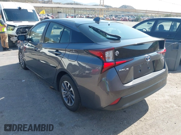 2021 Toyota Prius L Eco with VIN JTDKAMFU4M3144985, listed as a IAAI auction lot 42443957 with 20,816 mi miles and . Bid and sale history available at DreamBid. Image 3.
