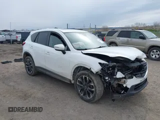 2016 Mazda CX-5 Grand Touring with VIN JM3KE4DY5G0875156, listed as a IAAI auction lot 42104058 with 178,526 mi miles and . Bid and sale history available at DreamBid. Image 1.