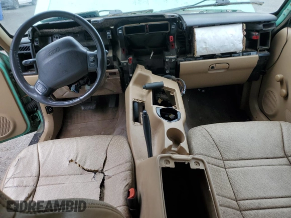 1999 Jeep Cherokee SE with VIN 1J4FF28SXXL641556, listed as a Copart auction lot 62605065 with Not provided miles and Salvage title. Bid and sale history available at DreamBid. Image 8.