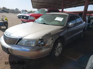 2002 Lincoln Continental with VIN 1LNHM97V62Y696179, listed as a IAAI auction lot 41745567 with 110,514 mi miles and . Bid and sale history available at DreamBid. Image 2.