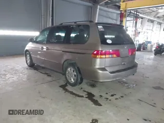 2003 Honda Odyssey EX-L with VIN 5FNRL18923B117592, listed as a IAAI auction lot 41546119 with 212,755 mi miles and . Bid and sale history available at DreamBid. Image 3.
