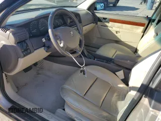 2001 Cadillac Catera z VIN W06VR54R21R039740, wystawiony jako Copart lot #77206494 z przebiegiem 41 180 mil mil oraz Szkody całkowita. Historia ofert i sprzedaży dostępna na DreamBid. Obrazek 7.