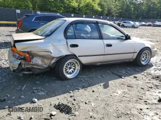 1995 Toyota Corolla DX with VIN 2T1AE09B0SC098739, listed as a Copart auction lot 57653205 with 154,226 mi miles and Salvage title. Bid and sale history available at DreamBid. Image 3.