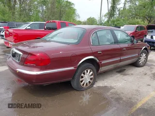 2000 Lincoln Continental with VIN 1LNHM97V5YY845447, listed as a IAAI auction lot 42077417 with 83,655 mi miles. Bid and sale history available at carsss.com. Image 4.