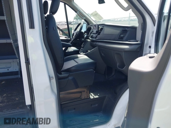 2023 Ford Transit Cargo with VIN 1FTBR1C80PKA43077, listed as a IAAI auction lot 40182475 with 15,656 mi miles and . Bid and sale history available at DreamBid. Image 5.