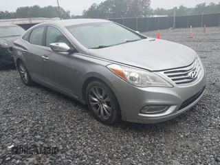 2013 Hyundai Azera z VIN KMHFG4JG7DA199553, wystawiony jako IAAI lot #42218944 z przebiegiem 131 959 mil mil oraz . Historia ofert i sprzedaży dostępna na DreamBid. Obrazek 1.
