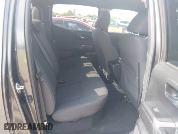 2018 Toyota Tacoma SR5 with VIN 3TMDZ5BN0JM051283, listed as a IAAI auction lot 42438690 with 106,155 mi miles and . Bid and sale history available at DreamBid. Image 8.