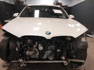 2021 BMW X1 xDrive28i with VIN WBXJG9C0XM5T76975, listed as a IAAI auction lot 41310115 with 26,869 mi miles. Bid and sale history available at carsss.com. Image 6.
