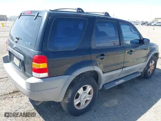 2001 Ford Escape XLT with VIN 1FMYU03141KF43980, listed as a IAAI auction lot 41989002 with 222,344 mi miles. Bid and sale history available at carsss.com. Image 4.