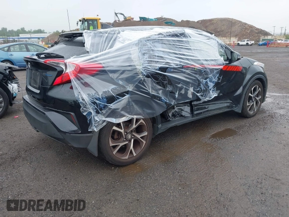 2018 Toyota C-HR XLE with VIN JTNKHMBX6J1000904, listed as a IAAI auction lot 42513117 with 77,192 mi miles and . Bid and sale history available at DreamBid. Image 4.