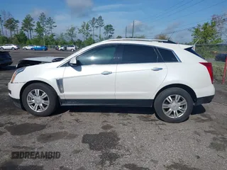 2013 Cadillac SRX Luxury Collection with VIN 3GYFNCE33DS608040, listed as a IAAI auction lot 41912860 with 128,295 mi miles and . Bid and sale history available at DreamBid. Image 14.