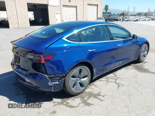 2019 Tesla Model 3 Mid Range with VIN 5YJ3E1EA0KF425079, listed as a IAAI auction lot 41871022 with 61,684 mi miles and . Bid and sale history available at DreamBid. Image 4.