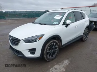 2016 Mazda CX-5 Grand Touring z VIN JM3KE4DY0G0705884, wystawiony jako IAAI lot #42016910 z przebiegiem 73 324 mil mil oraz . Historia ofert i sprzedaży dostępna na DreamBid. Obrazek 17.