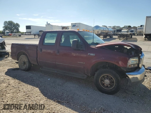 2000 Ford F-350 XL with VIN 1FTSW30F6YEB89796, listed as a Copart auction lot 67490144 with 517,242 mi miles and Salvage Title. Bid and sale history available at DreamBid. Image 4.