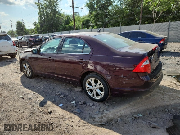 2012 Ford Fusion SE z VIN 3FAHP0HA7CR387524, wystawiony jako Copart lot #62083235 z przebiegiem 104 698 mil mil oraz Szkoda całkowita • Salvage title. Historia ofert i sprzedaży dostępna na DreamBid. Obrazek 2.