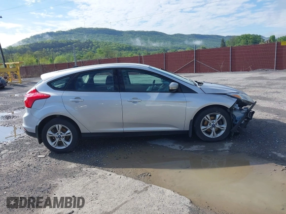 2012 Ford Focus SE z VIN 1FAHP3K27CL241013, wystawiony jako IAAI lot #42198812 z przebiegiem 121 888 mil mil oraz . Historia ofert i sprzedaży dostępna na DreamBid. Obrazek 14.