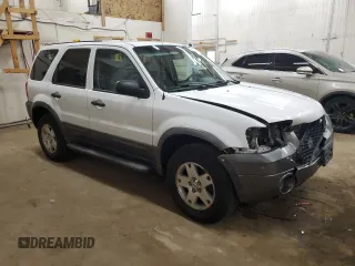 2006 Ford Escape XLT with VIN 1FMCU03106KC14923, listed as a Copart auction lot 52727095 with 126,842 mi miles and Salvage Title. Bid and sale history available at DreamBid. Image 4.