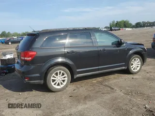 2013 Dodge Journey SXT with VIN 3C4PDCBG4DT619319, listed as a Copart auction lot 62964135 with 140,620 mi miles and Salvage title. Bid and sale history available at DreamBid. Image 3.