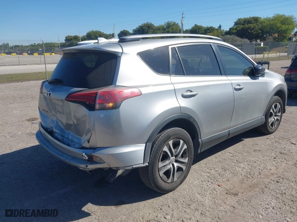 2018 Toyota RAV4 LE with VIN JTMZFREVXJJ196183, listed as a IAAI auction lot 41776107 with 82,713 mi miles. Bid and sale history available at carsss.com. Image 4.