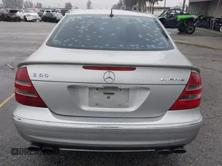 2003 Mercedes-Benz E-Class 5.5L AMG with VIN WDBUF76J93A351317, listed as a IAAI auction lot 41573446 with 144,119 mi miles. Bid and sale history available at carsss.com. Image 16.