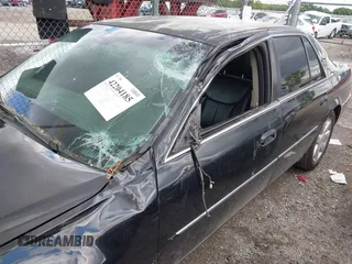 2008 Cadillac DTS 1SA z VIN 1G6KD57Y98U102801, wystawiony jako IAAI lot #42204185 z przebiegiem 152 990 mil mil oraz . Historia ofert i sprzedaży dostępna na DreamBid. Obrazek 6.