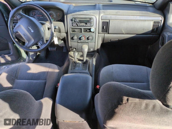 2001 Jeep Grand Cherokee Laredo with VIN 1J4GW48N21C570404, listed as a Copart auction lot 85996954 with 153,838 mi miles and Salvage title. Bid and sale history available at DreamBid. Image 8.