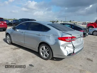 2018 Ford Fusion SE z VIN 3FA6P0LU2JR281231, wystawiony jako IAAI lot #41963083 z przebiegiem 115 434 mil mil oraz . Historia ofert i sprzedaży dostępna na DreamBid. Obrazek 3.