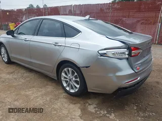 2020 Ford Fusion SE z VIN 3FA6P0LU4LR148070, wystawiony jako IAAI lot #42262446 z przebiegiem 69 057 mil mil oraz . Historia ofert i sprzedaży dostępna na DreamBid. Obrazek 6.
