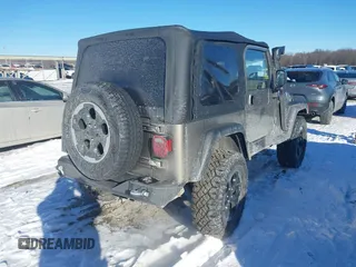 2004 Jeep Wrangler Sahara with VIN 1J4FA59S94P731123, listed as a IAAI auction lot 41288284 with 138,515 mi miles and . Bid and sale history available at DreamBid. Image 4.