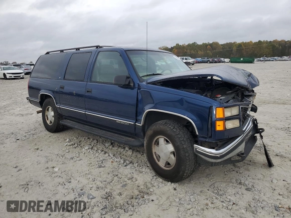 1997 GMC Suburban with VIN 3GKFK16R4VG519902, listed as a Copart auction lot 79031204 with 195,624 mi miles and Salvage Title. Bid and sale history available at DreamBid. Image 4.
