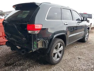 2015 Jeep Grand Cherokee Overland with VIN 1C4RJFCT4FC138404, listed as a IAAI auction lot 41188085 with 152,486 mi miles. Bid and sale history available at carsss.com. Image 4.