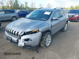 2014 Jeep Cherokee Latitude z VIN 1C4PJMCSXEW294950, wystawiony jako IAAI lot #42179152 z przebiegiem 105 796 mil mil oraz . Historia ofert i sprzedaży dostępna na DreamBid. Obrazek 2.