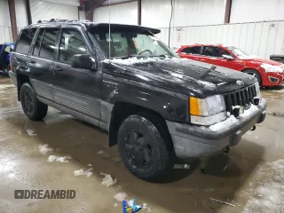 1995 Jeep Grand Cherokee Laredo with VIN 1J4GZ58Y5SC565187, listed as a Copart auction lot 45179985 with 122,863 mi miles and Salvage Title. Bid and sale history available at carsss.com. Image 4.
