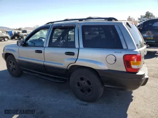 1999 Jeep Grand Cherokee Laredo with VIN 1J4GW58N4XC739465, listed as a Copart auction lot 76130544 with 195,649 mi miles and Salvage Title. Bid and sale history available at carsss.com. Image 2.