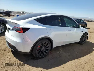 2024 Tesla Model Y Performance with VIN 7SAYGDEF6RA284171, listed as a Copart auction lot 50317205 with 6,870 mi miles and Salvage Title. Bid and sale history available at DreamBid. Image 3.