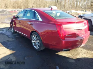 2014 Cadillac XTS Luxury z VIN 2G61N5S34E9163874, wystawiony jako IAAI lot #41649292 z przebiegiem 104 638 mil mil oraz . Historia ofert i sprzedaży dostępna na DreamBid. Obrazek 3.