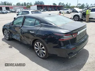 2023 Nissan Maxima Platinum z VIN 1N4AA6FV0PC502349, wystawiony jako IAAI lot #42114011 z przebiegiem 7 494 mil mil oraz . Historia ofert i sprzedaży dostępna na DreamBid. Obrazek 3.