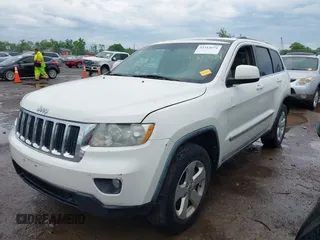 2011 Jeep Grand Cherokee Laredo z VIN 1J4RR4GG1BC572827, wystawiony jako IAAI lot #42313674 z przebiegiem 273 215 mil mil oraz . Historia ofert i sprzedaży dostępna na DreamBid. Obrazek 2.