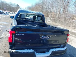 2023 Ford F-150 Lightning Pro with VIN 1FTVW1EL7PWG07081, listed as a IAAI auction lot 38702102 with 9,976 mi miles and . Bid and sale history available at DreamBid. Image 16.
