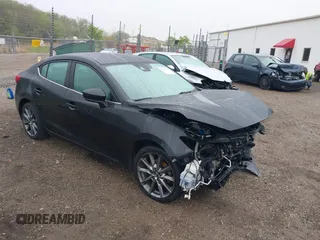 2018 Mazda 3 Touring z VIN 3MZBN1V3XJM219112, wystawiony jako IAAI lot #42177323 z przebiegiem 184 790 mil mil oraz . Historia ofert i sprzedaży dostępna na DreamBid. Obrazek 1.