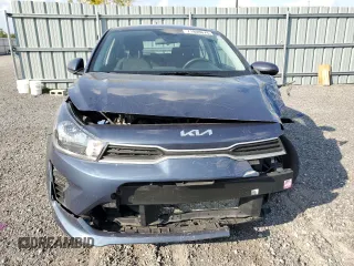 2023 Kia Rio S with VIN 3KPA25AD5PE548218, listed as a Copart auction lot 71808674 with 24,412 mi miles and Salvage Title. Bid and sale history available at DreamBid. Image 5.