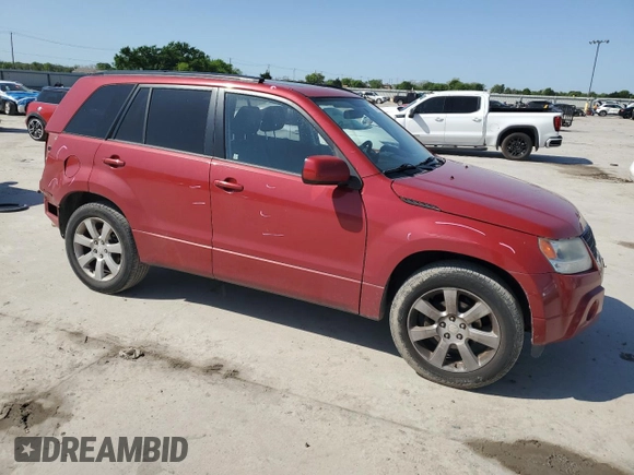 2011 Suzuki Grand Vitara Limited z VIN JS3TE0D72B4100054, wystawiony jako Copart lot #52535705 z przebiegiem 131 468 mil mil oraz Szkoda całkowita • Salvage title. Historia ofert i sprzedaży dostępna na DreamBid. Obrazek 4.