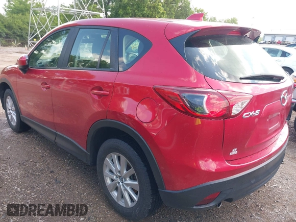 2015 Mazda CX-5 Sport with VIN JM3KE2BE8F0451014, listed as a IAAI auction lot 42536333 with 131,059 mi miles and . Bid and sale history available at DreamBid. Image 3.