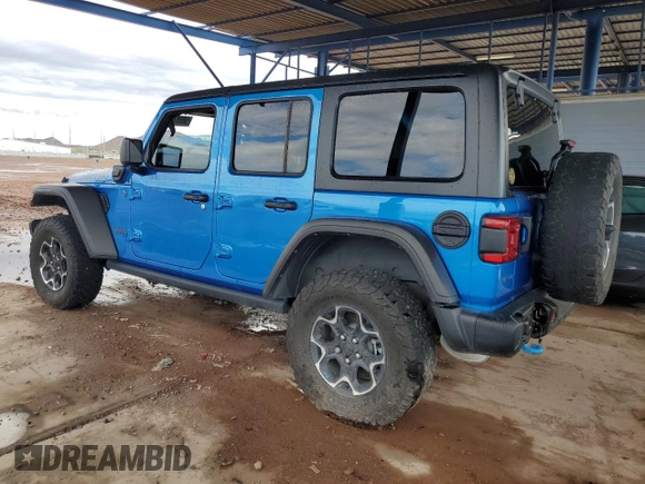 2023 Jeep Wrangler Rubicon with VIN 1C4JJXR69PW581362, listed as a Copart auction lot 58557795 with 34,357 mi miles and Salvage title. Bid and sale history available at DreamBid. Image 2.