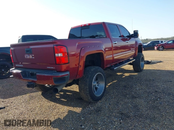 2018 GMC Sierra 2500HD Denali z VIN 1GT12UEY6JF272619, wystawiony jako IAAI lot #41743216 z przebiegiem 165 231 mil mil oraz . Historia ofert i sprzedaży dostępna na DreamBid. Obrazek 4.