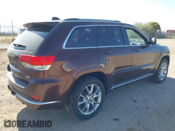 2015 Jeep Grand Cherokee Summit with VIN 1C4RJFJGXFC125131, listed as a IAAI auction lot 42475017 with 128,166 mi miles and . Bid and sale history available at DreamBid. Image 4.