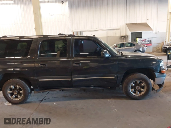 2004 Chevrolet Suburban LT z VIN 1GNFK16Z64J268977, wystawiony jako IAAI lot #41573029 z przebiegiem 181 923 mil mil oraz . Historia ofert i sprzedaży dostępna na DreamBid. Obrazek 13.