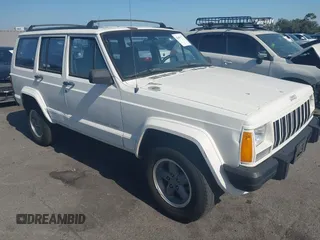 1996 Jeep Cherokee Sport z VIN 1J4FT68S7TL265733, wystawiony jako IAAI lot #42499228 z przebiegiem 230 001 mil mil oraz . Historia ofert i sprzedaży dostępna na DreamBid. Obrazek 1.